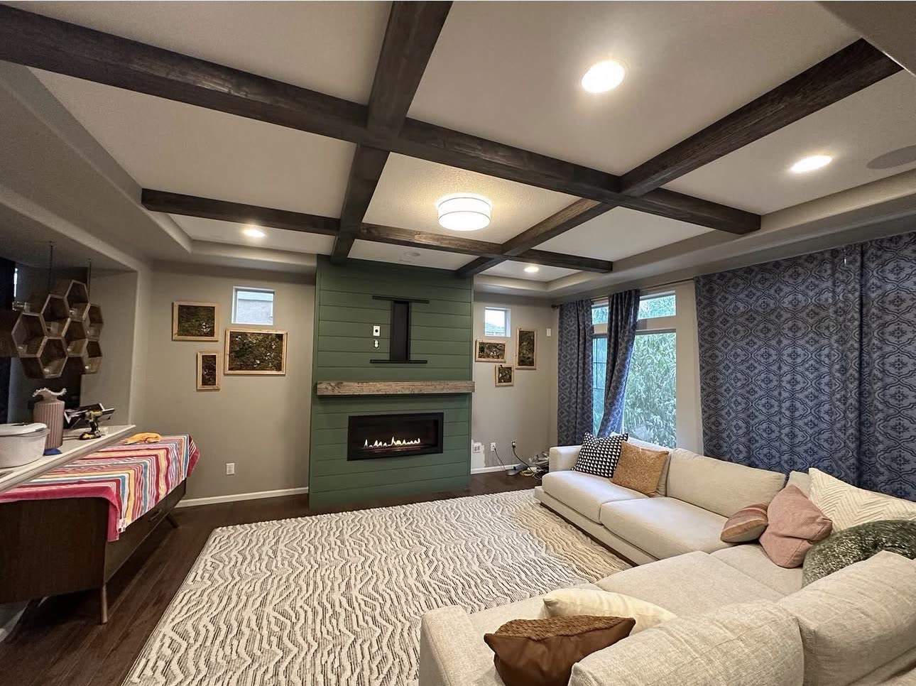 Living room remodel with a coffered ceiling and stained beams